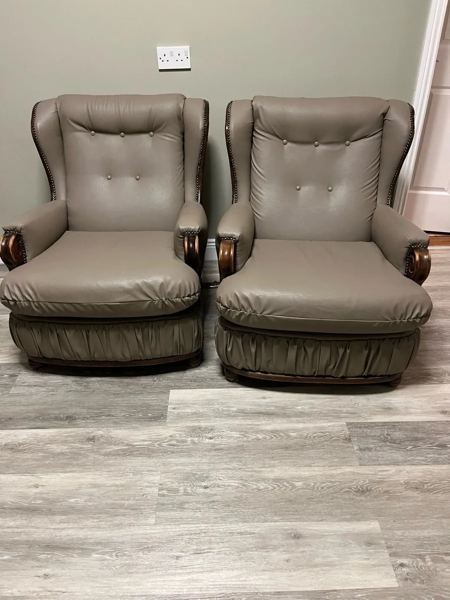 Two hardwood arm chairs