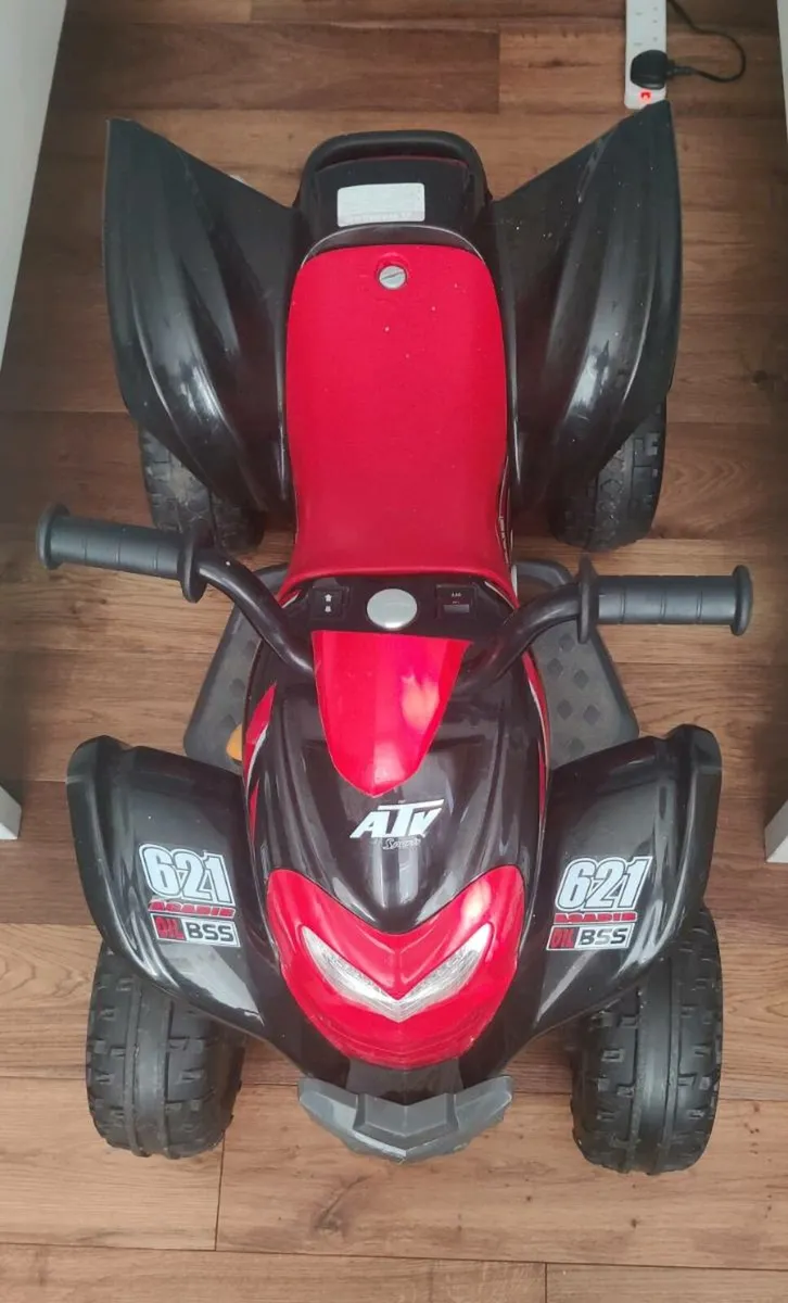 Kids ride on electric bike - Image 1