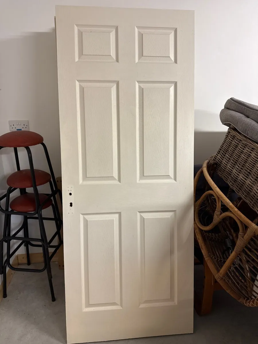 Ten white panel doors