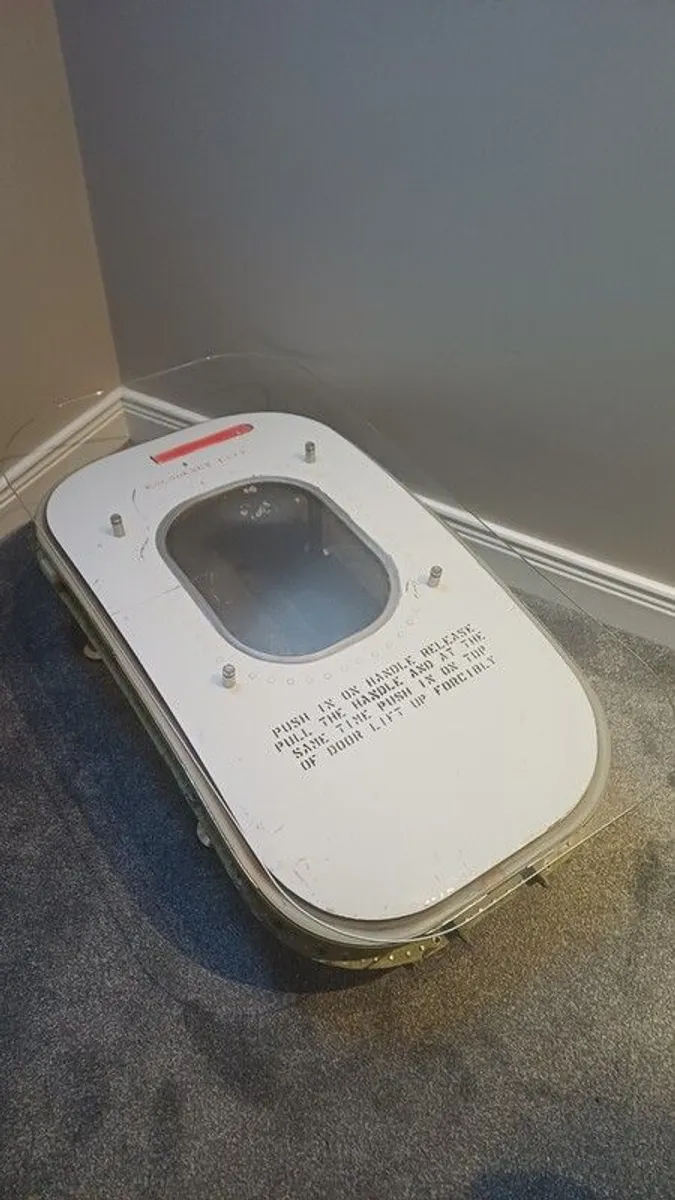 Coffee Table Crafted from an Upcycled McDonnell Douglas MD-83 Aircraft Emergency Exit Door - Image 1