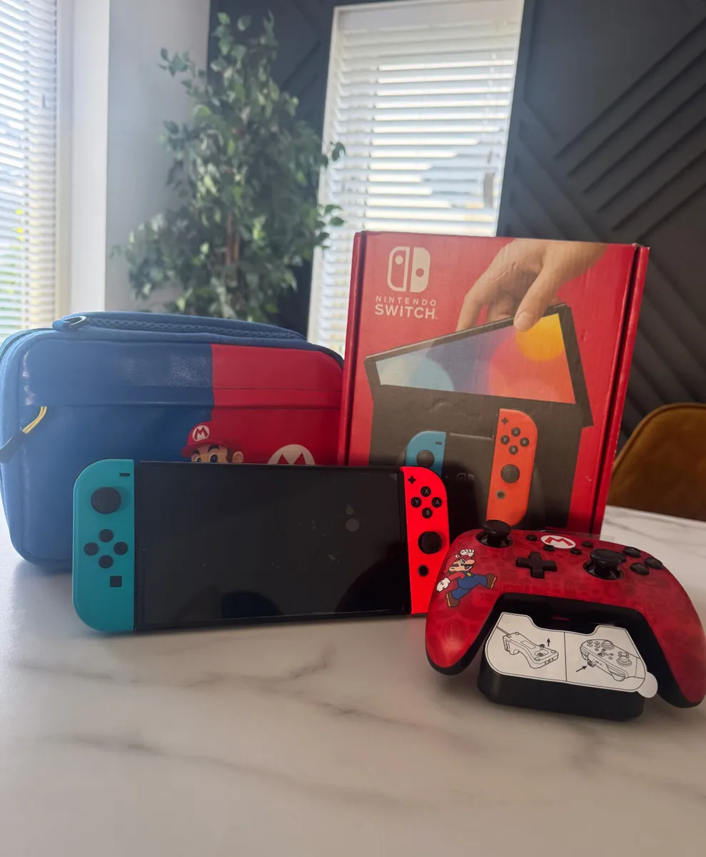 Nintendo OLED with Mario case and remote