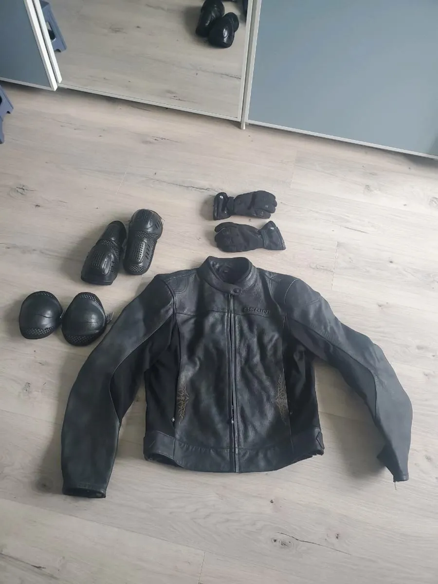 Ladies bering small leather biker jacket - Image 1