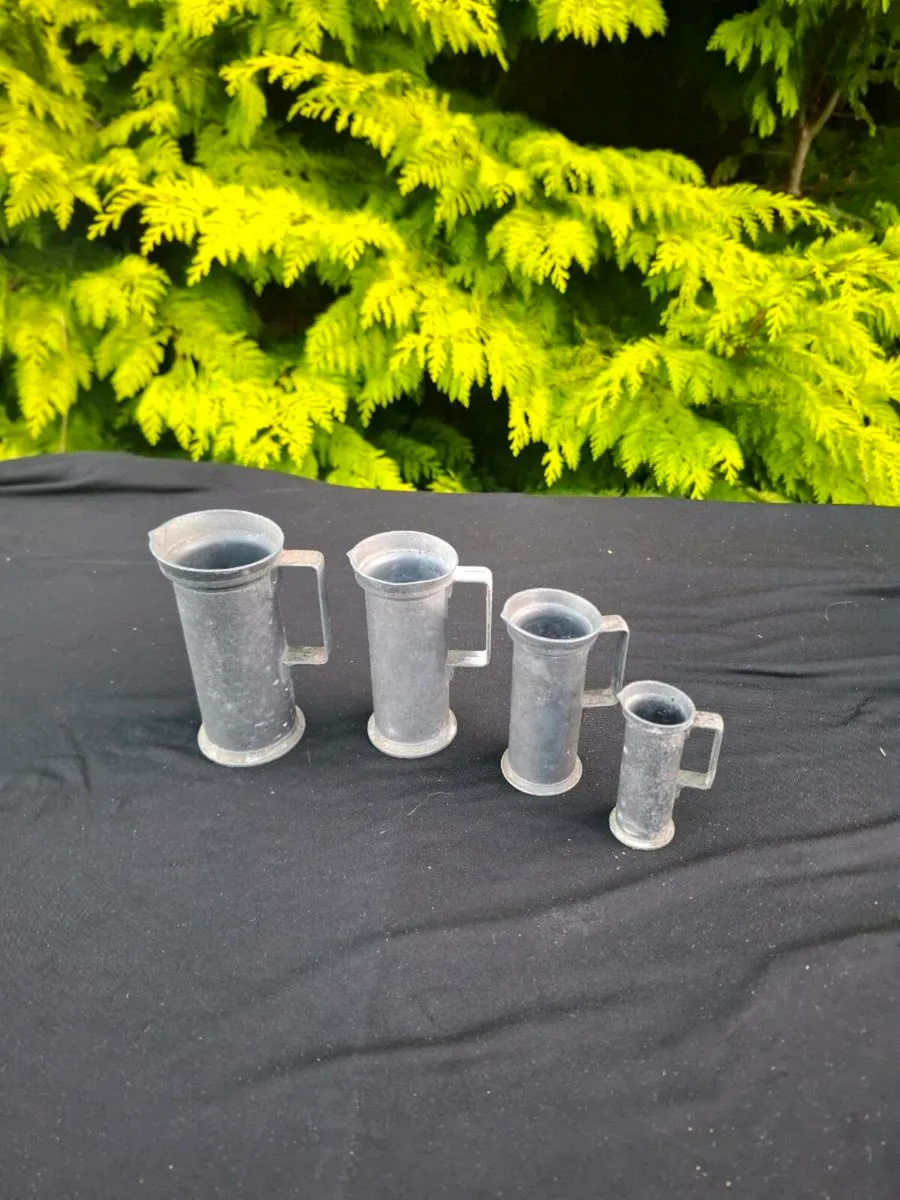 4 pewter jugs postage possible