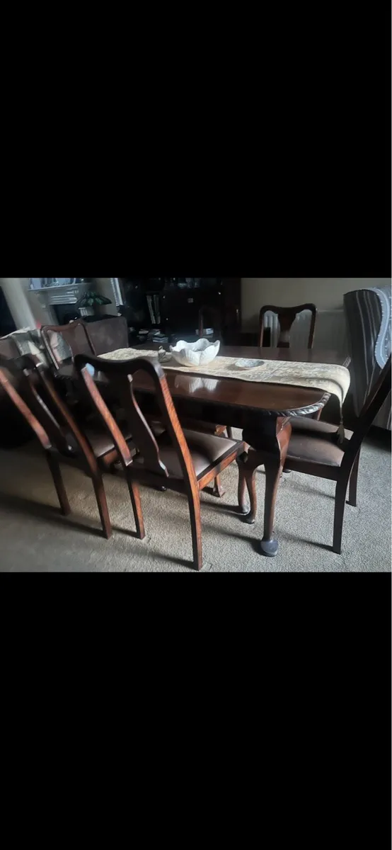 Antique dining room wooden table and 6 matching - Image 1