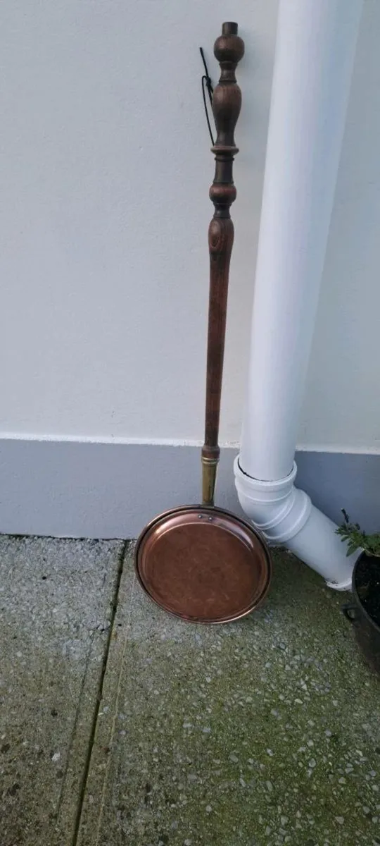 Old copper bed warmer