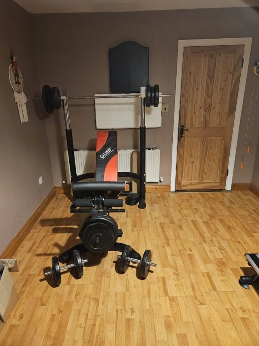 a bench and weights - Image 1