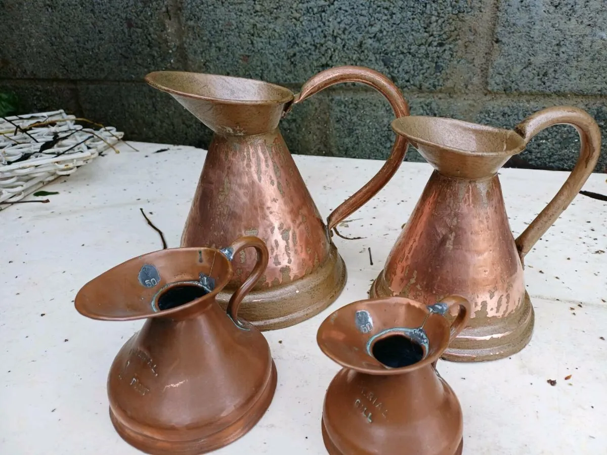 Antique Graduated Copper Jugs - Image 1