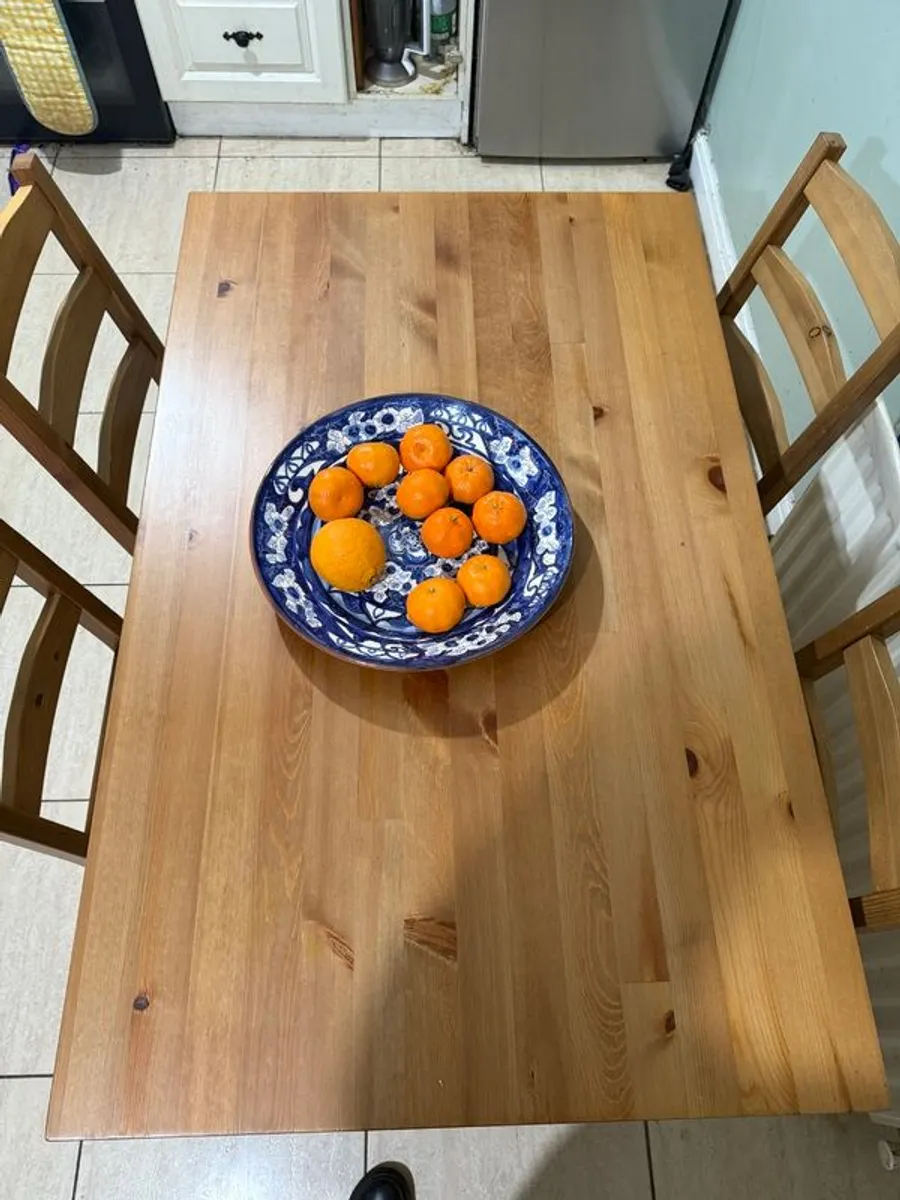 Dark stained pine table and 4 chairs. - Image 2