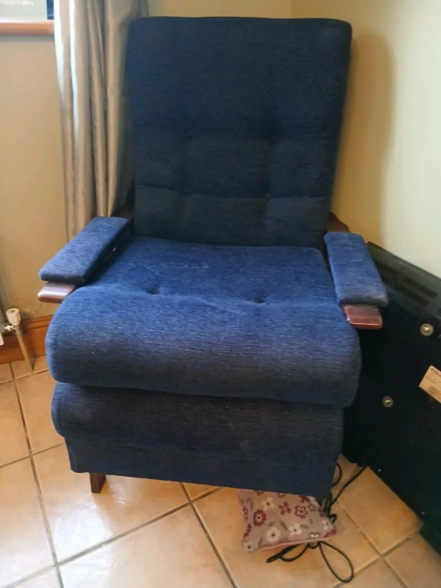 A chair , an exercise bike, and a wheelchair - Image 1