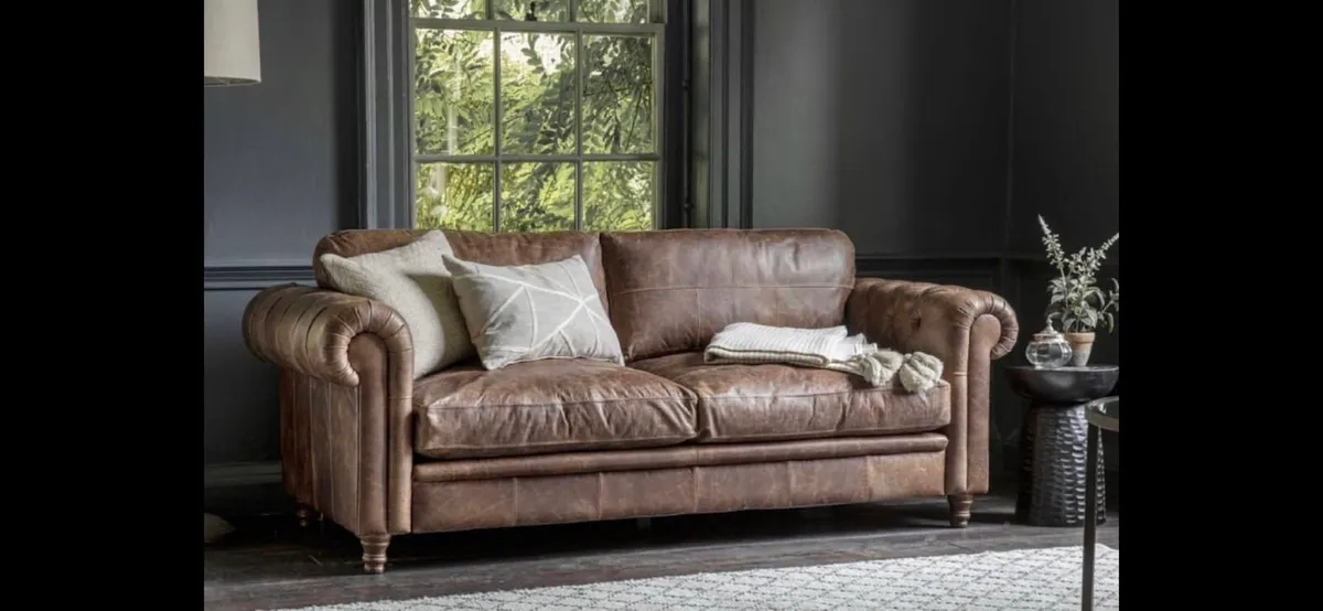 Leather chesterfield style sofa.