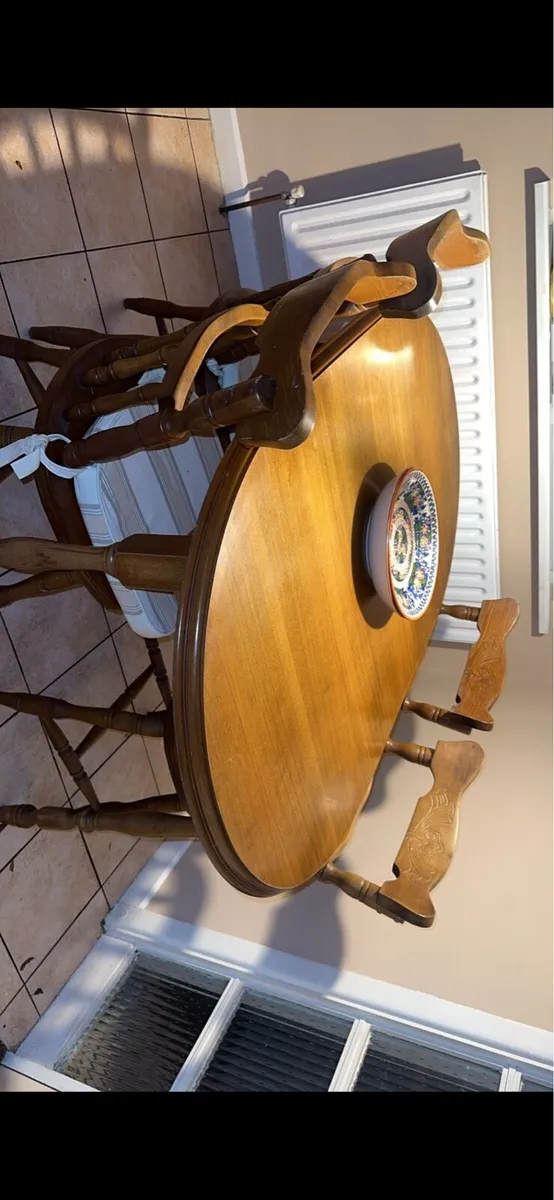 Solid oak dining table with matching chairs - Image 2