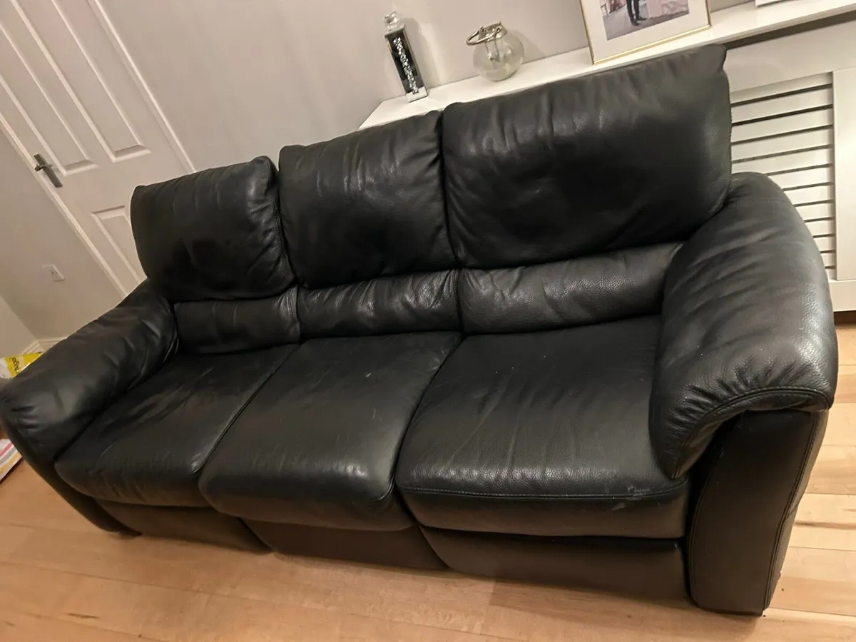 Black leather sofa recliner - Image 1