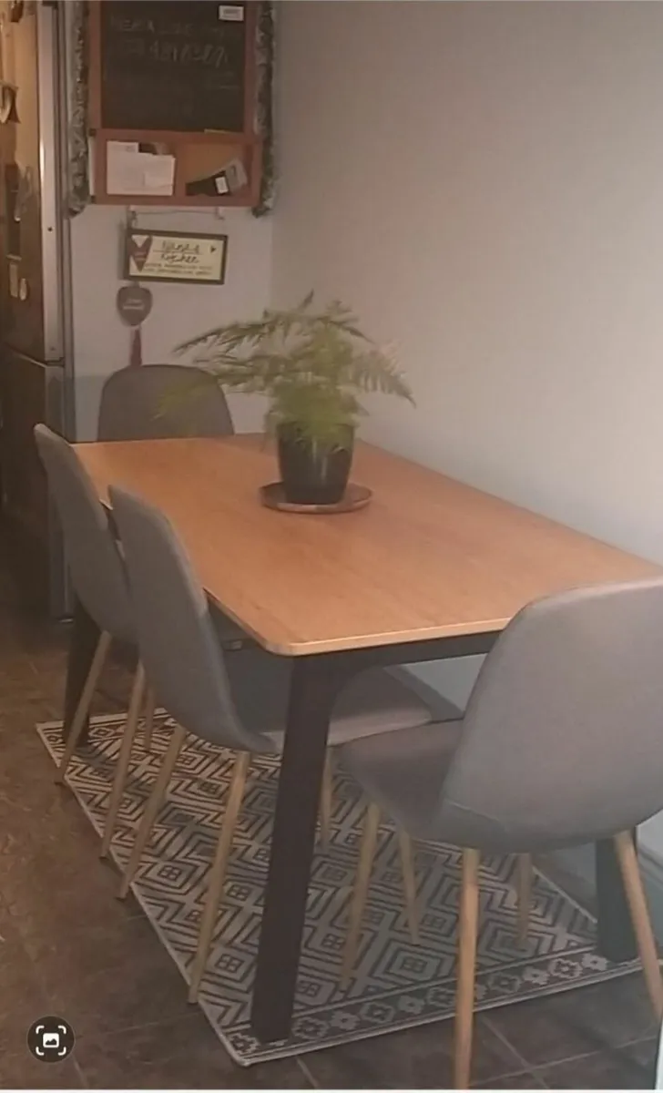 Bamboo top dining table with 4 grey cloth chairs - Image 1