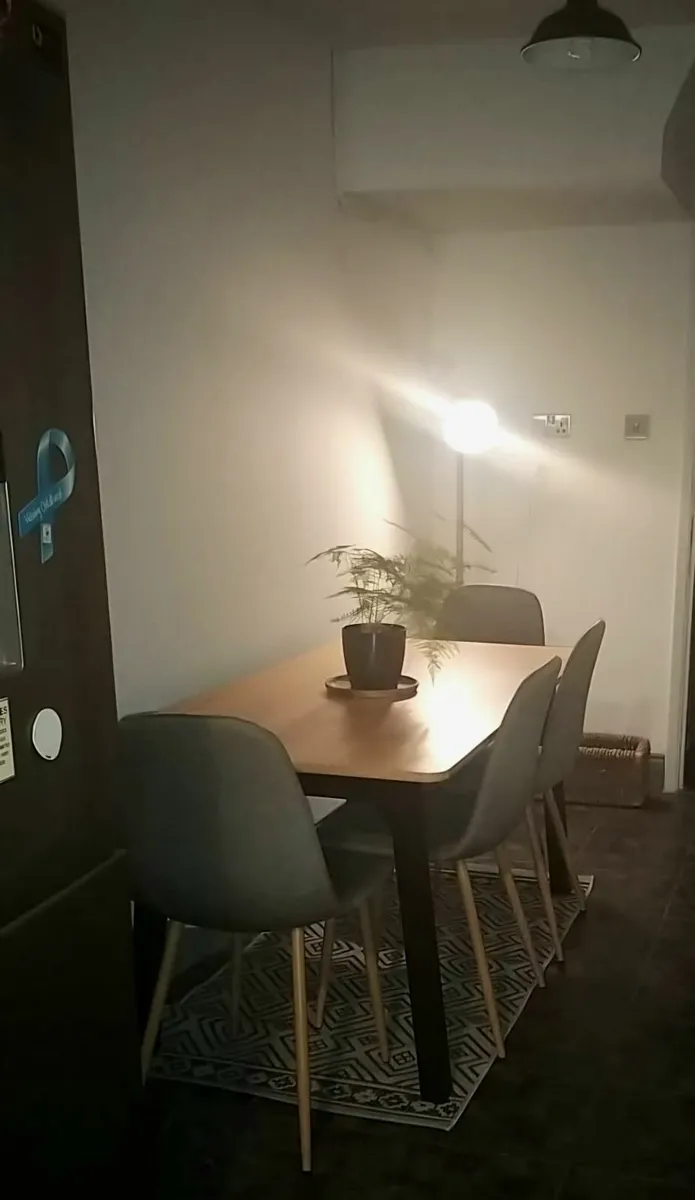 Bamboo top dining table with 4 grey cloth chairs - Image 2