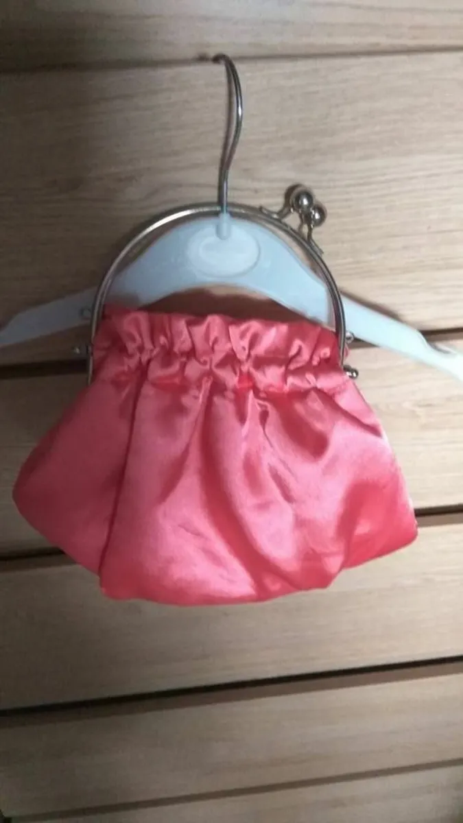 coral clutch bag never worn - Image 1