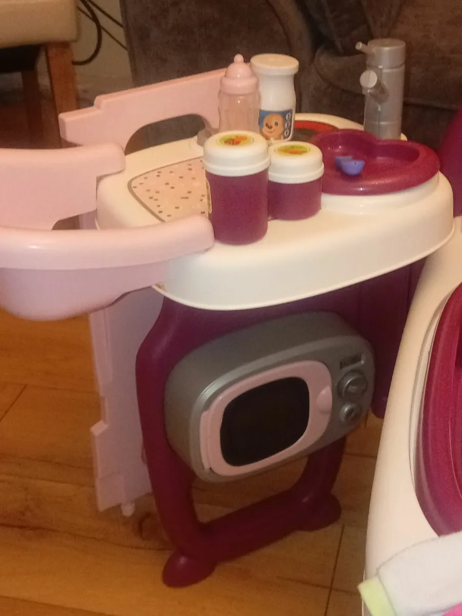 Baby doll changing and feeding station with doll