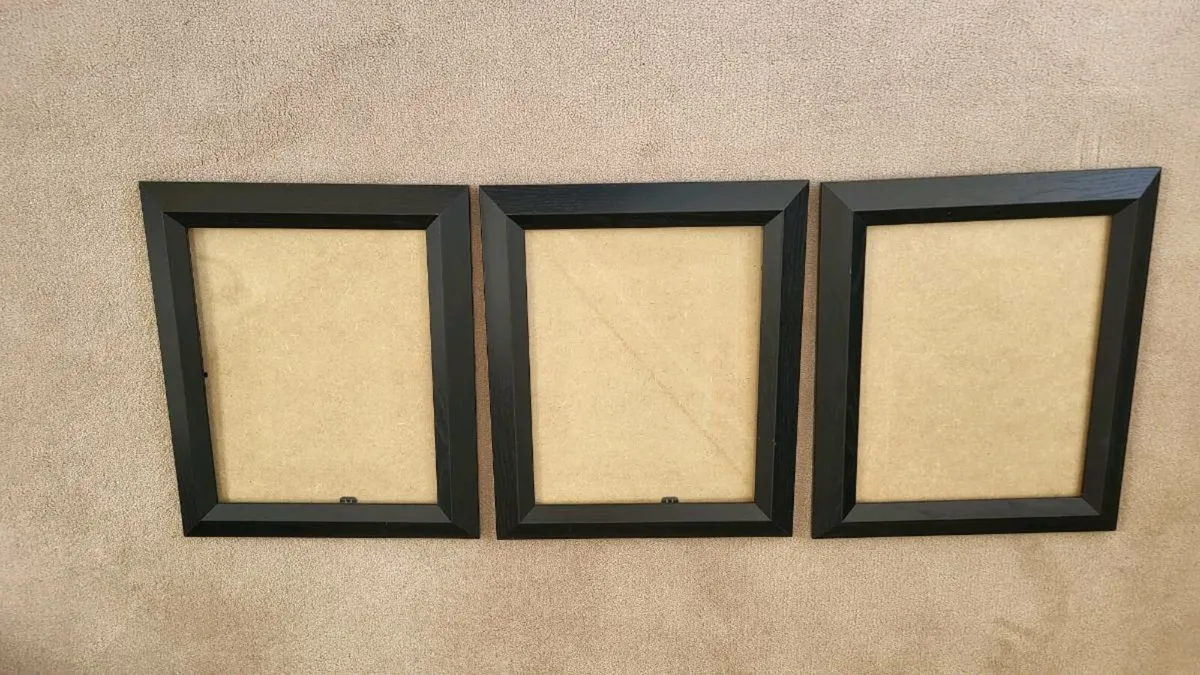 3 Black photo frames with glass.