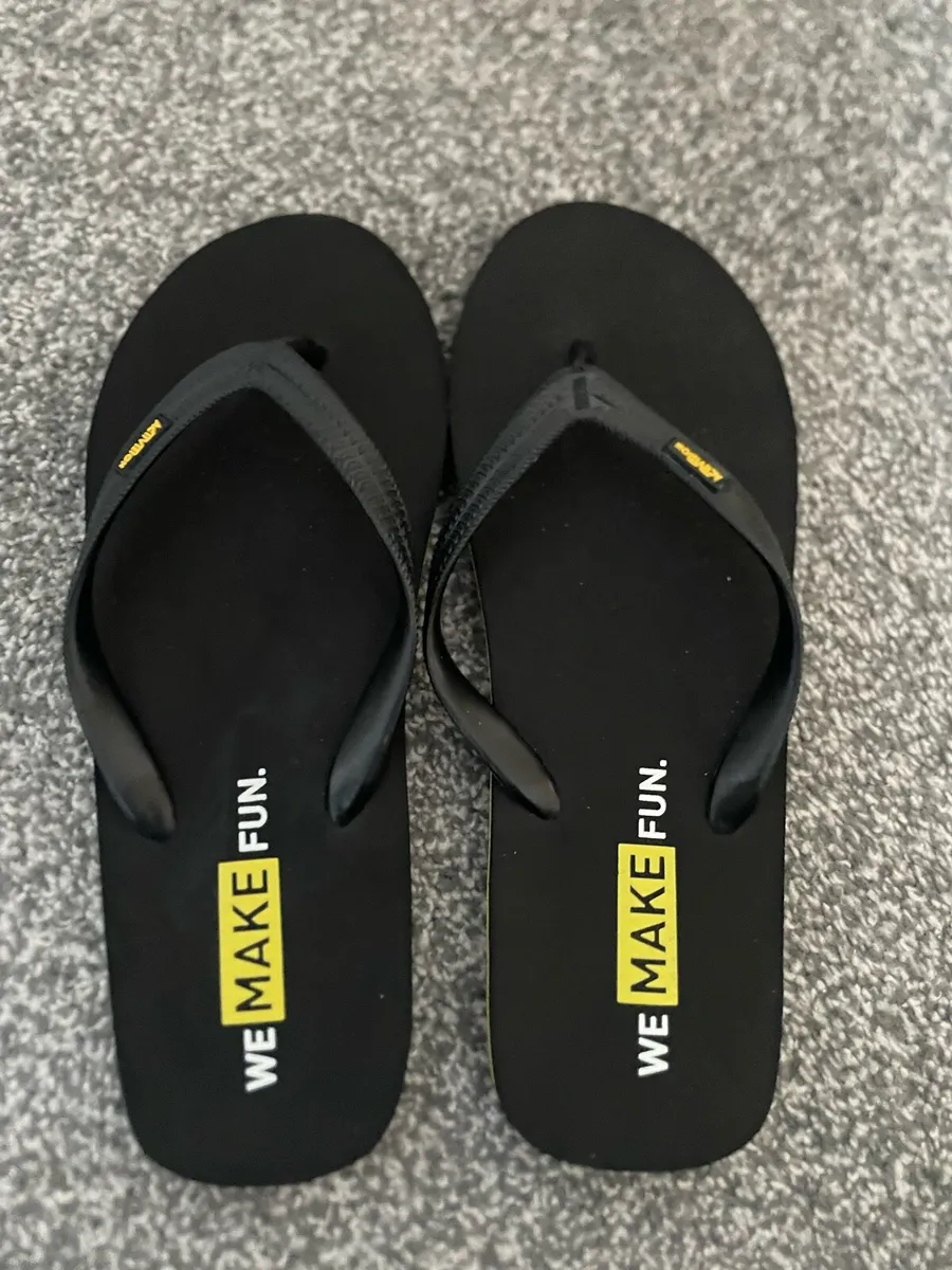 Activision Black & Yellow Sliders Flip Flops - Image 1