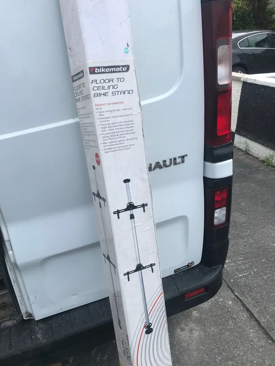 Floor and ceiling bike stand