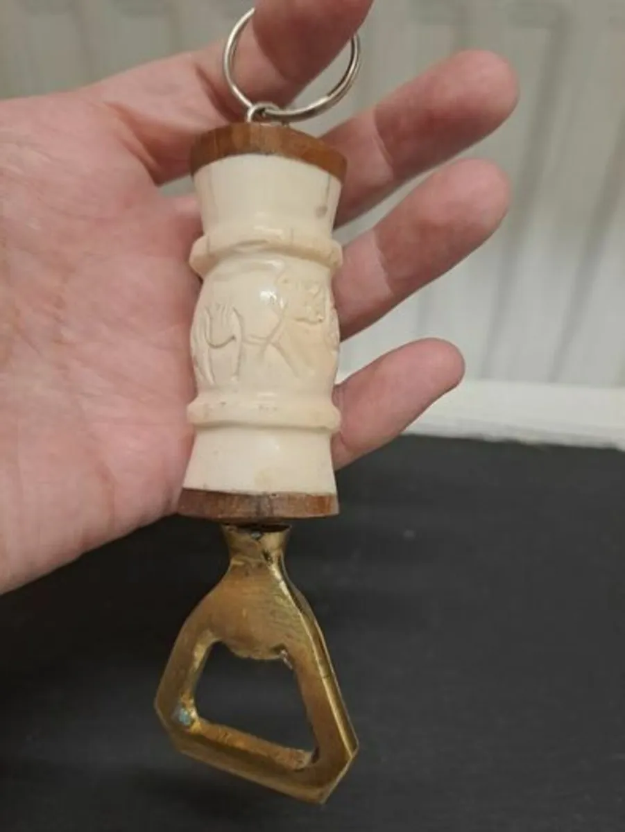 Carved bone and Copper bottle opener Zambia - Image 1