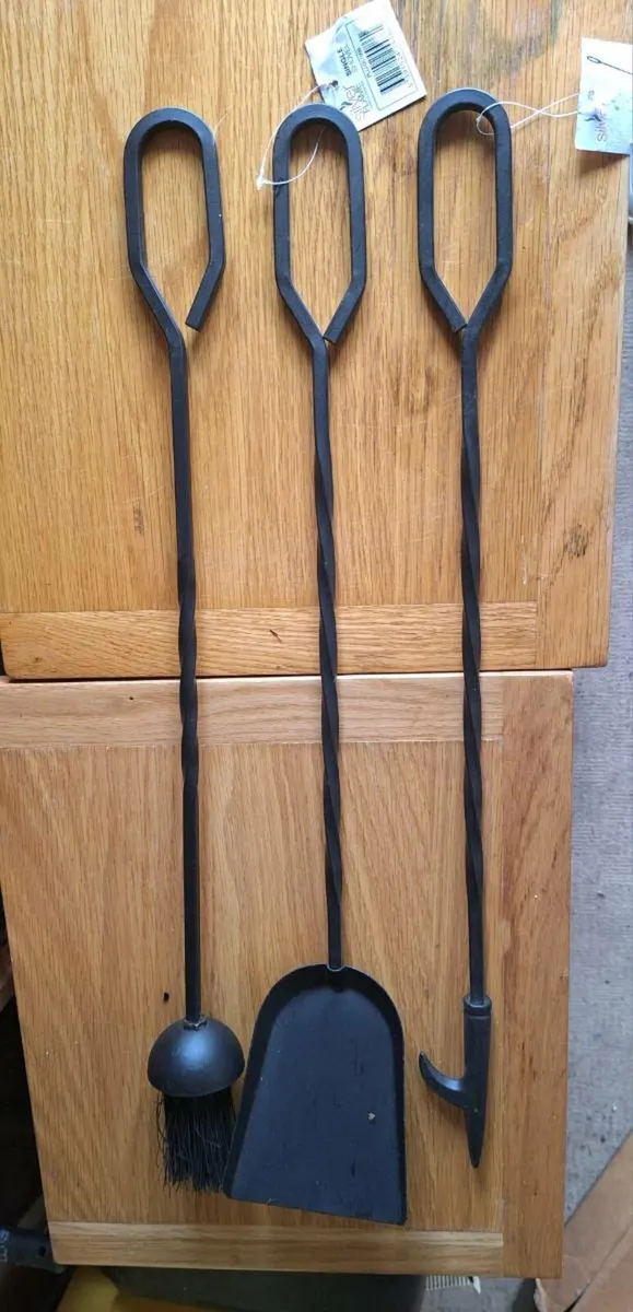 Three long handled fire tools