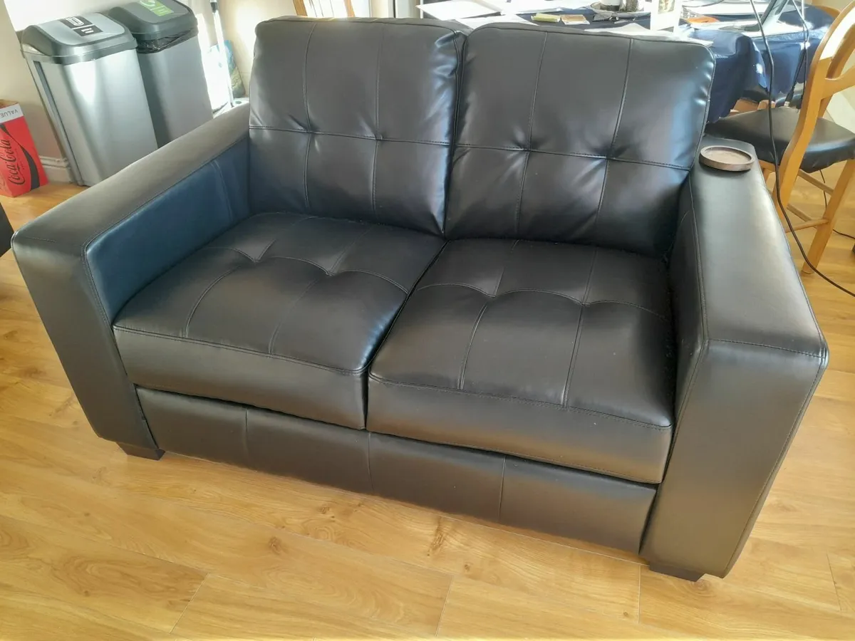 Black 2 seater Faux Leather Sofa- Virtually New