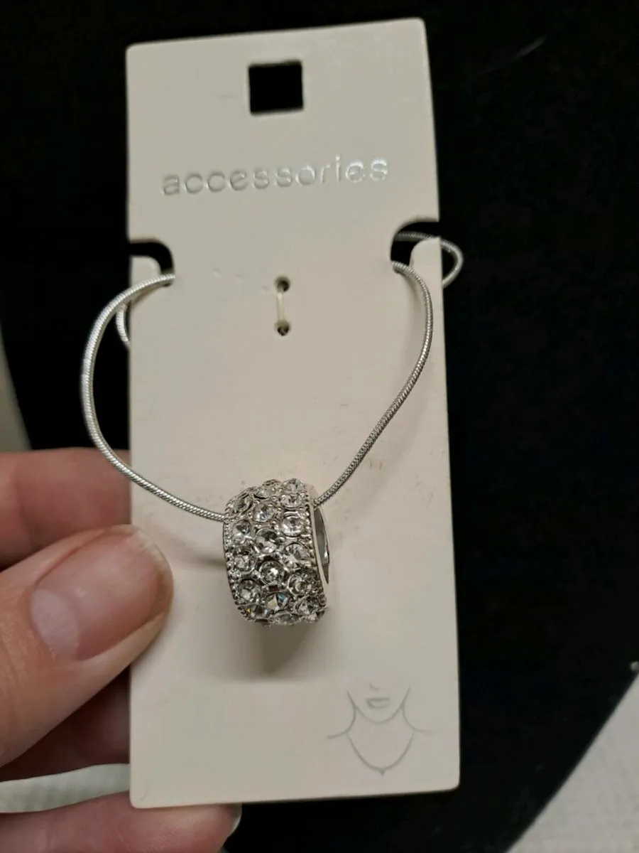 Silver necklace and multiple earrings set - Image 4