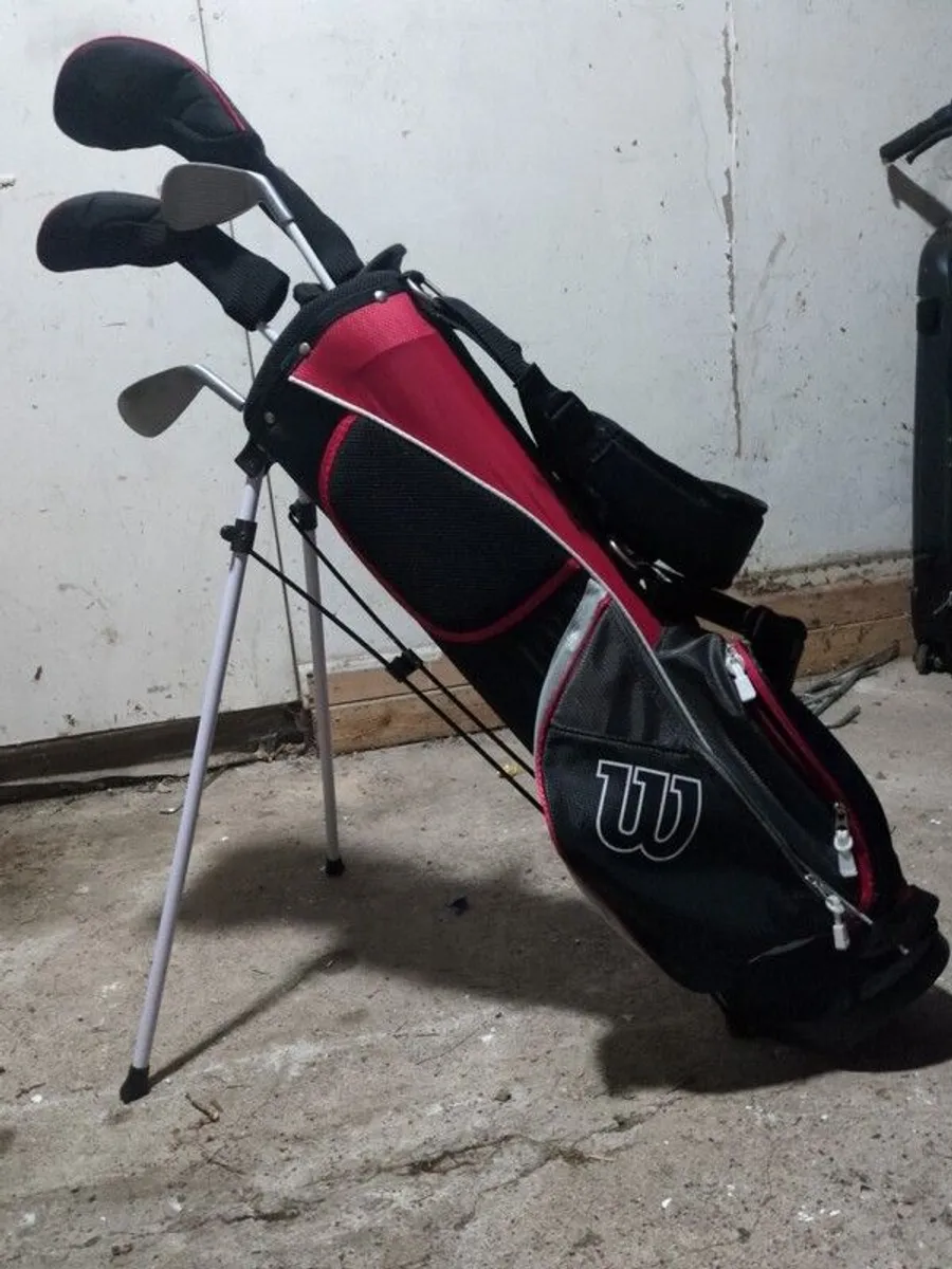 Junior Left handed Wilson golf clubs and bag - Image 1