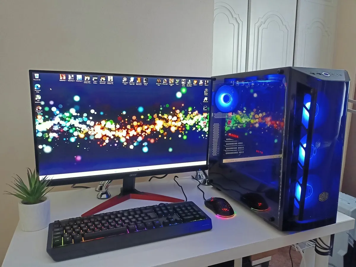 Powerful gaming PC setup with monitor and keyboard - Image 1