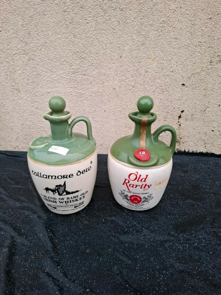 2 whiskey bottles possible to post