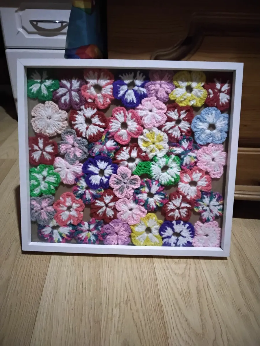 Crochet flowers in frame