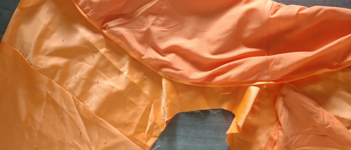 Solid orange satin look piece of fabric with beads - Image 1