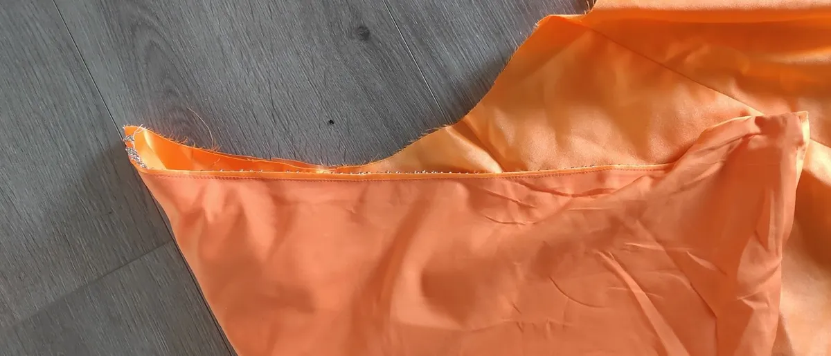 Solid orange satin look piece of fabric with beads - Image 3