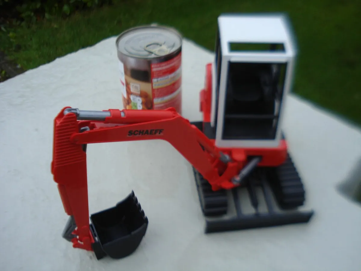 BRUDER SCHAEFF HR16 MINI EXCAVATOR. 1/16 SCALE. - Image 1
