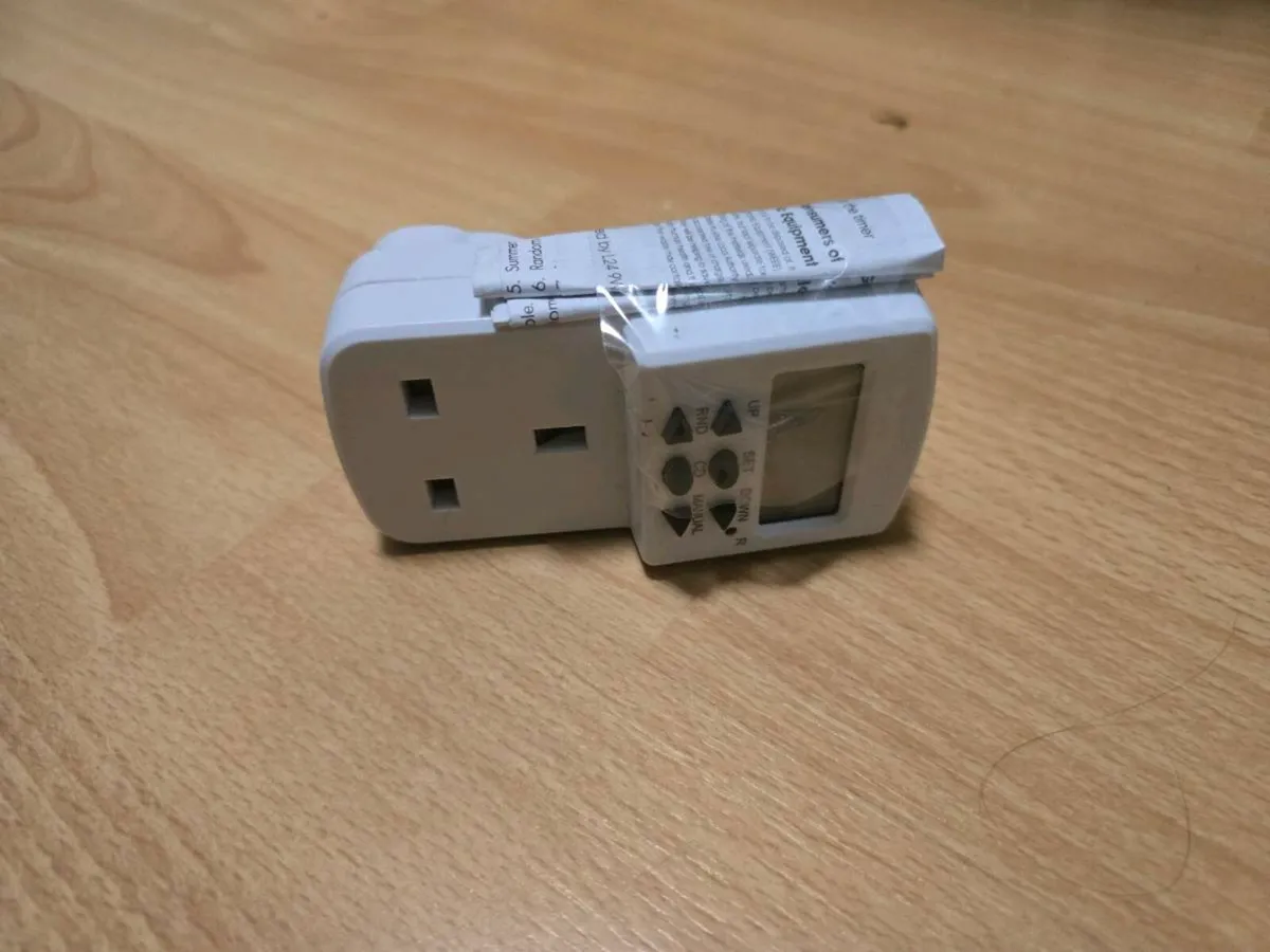 Plug-in timer / socket with timer