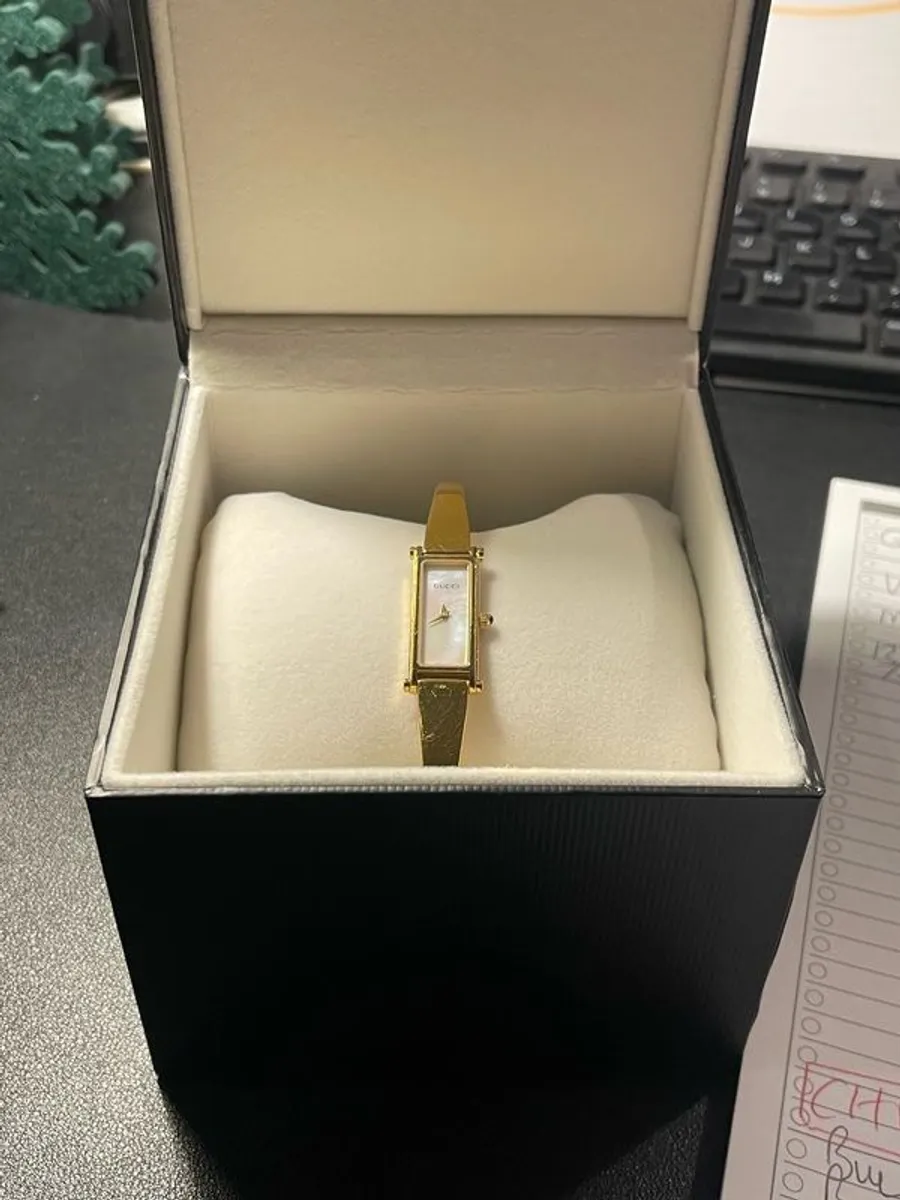 Vintage 1990s Ladies' Gold-Plated Gucci 1500L Bangle Quartz Watch with Rectangular Mother of Pearl Dial - Boxed - Image 1