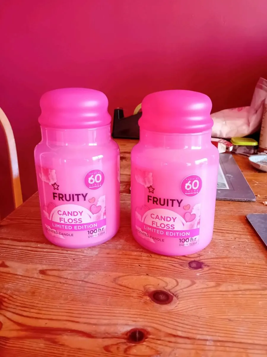 2 large seated candles in glass jars