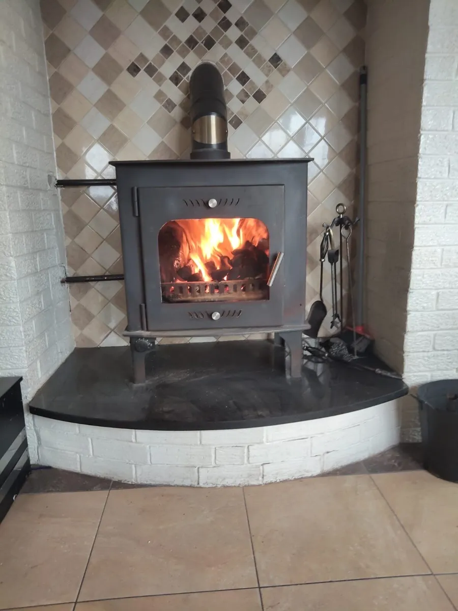 Solid fuel stove heats 12 radiators