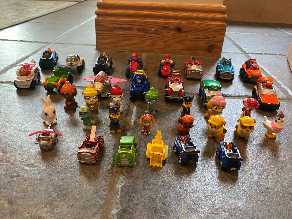 Bundle of small Paw Patrol vehicles and pups