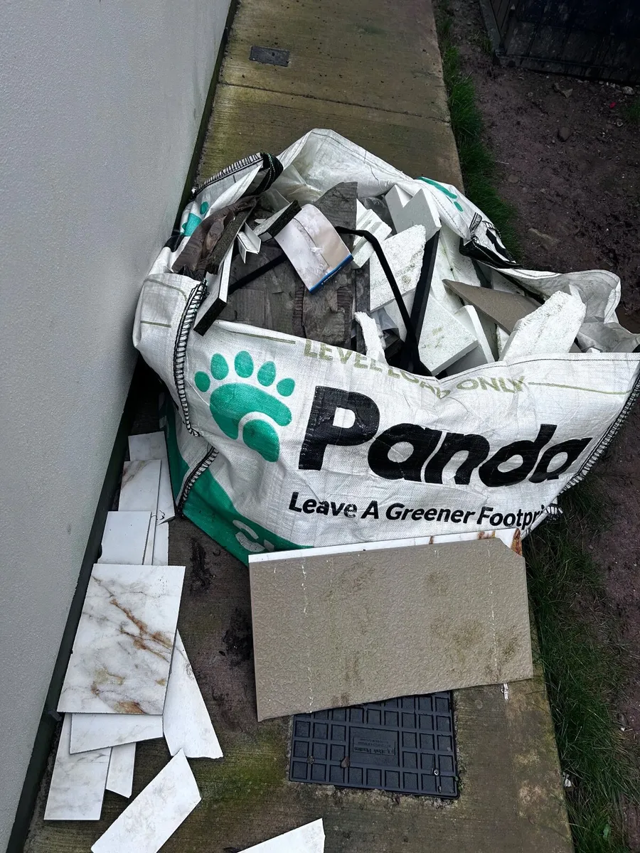 Skip full of - off cut tiles and wood