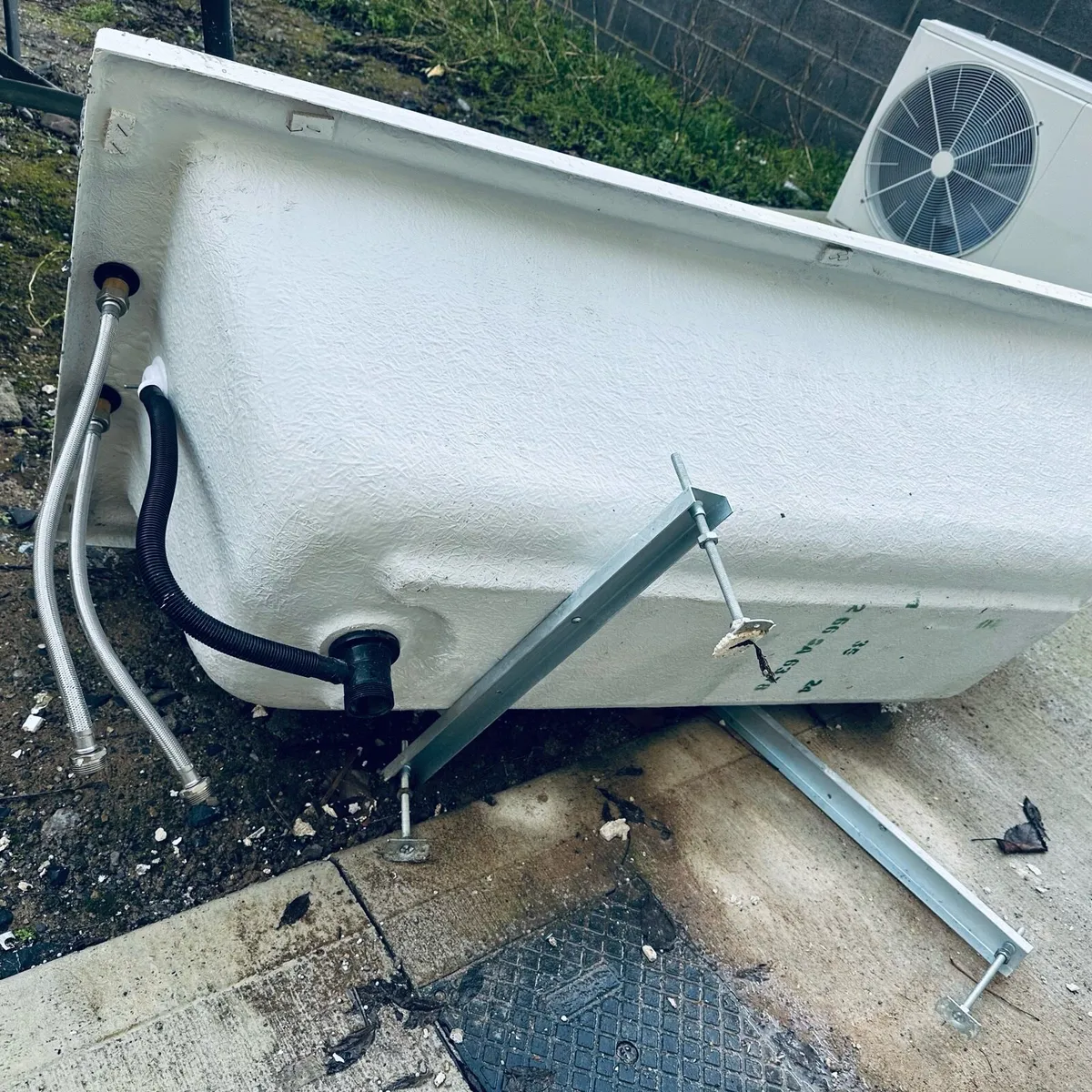 Bathroom tub with accessories in picture and basin - Image 2