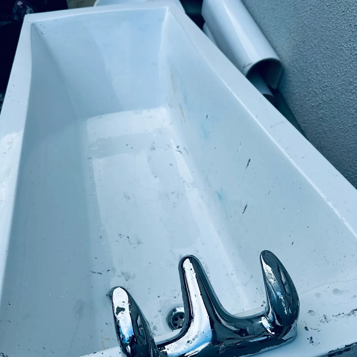 Bathroom tub with accessories in picture and basin - Image 4