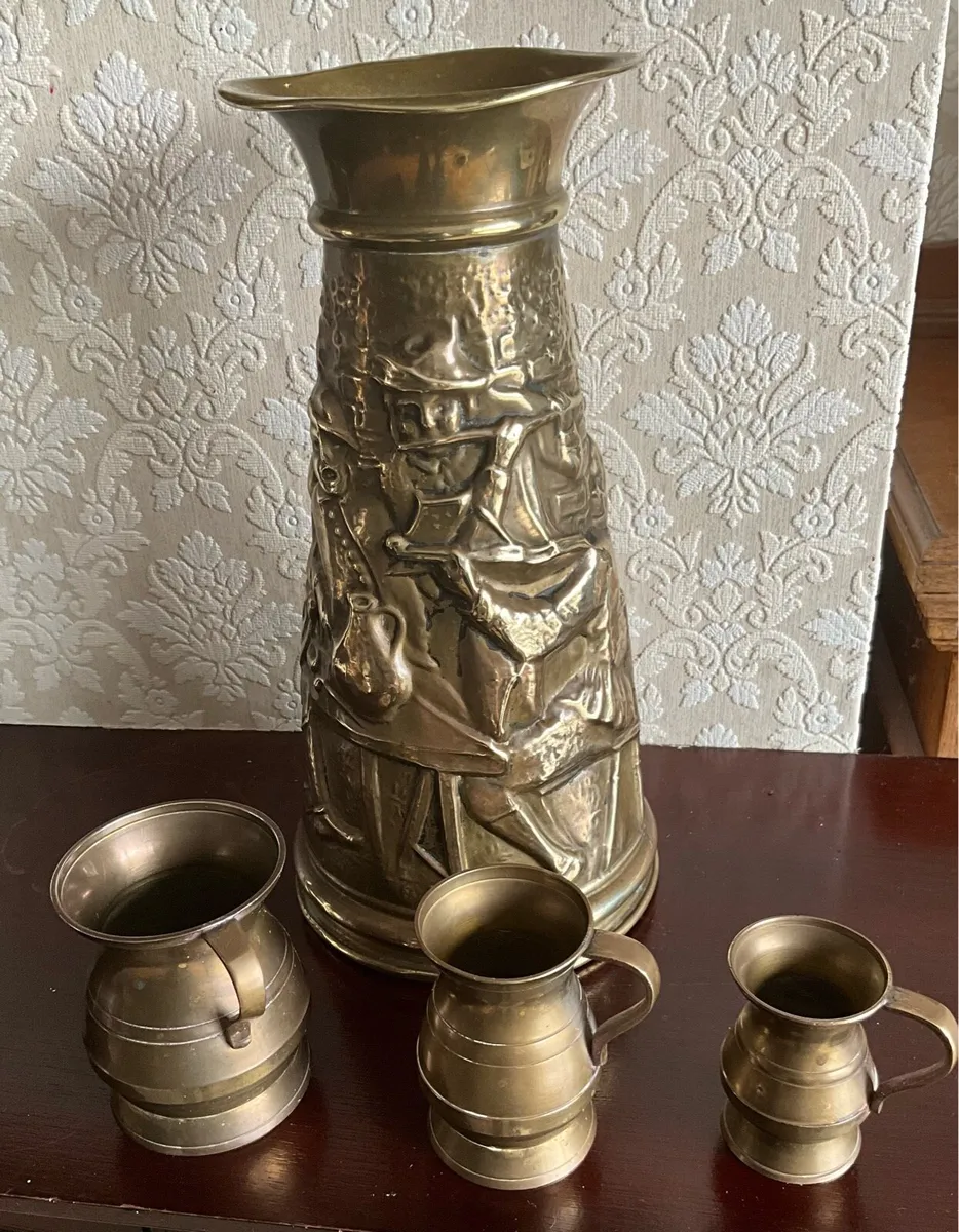 Set of 4 Antique Brass Embossed Pitchers - Image 1