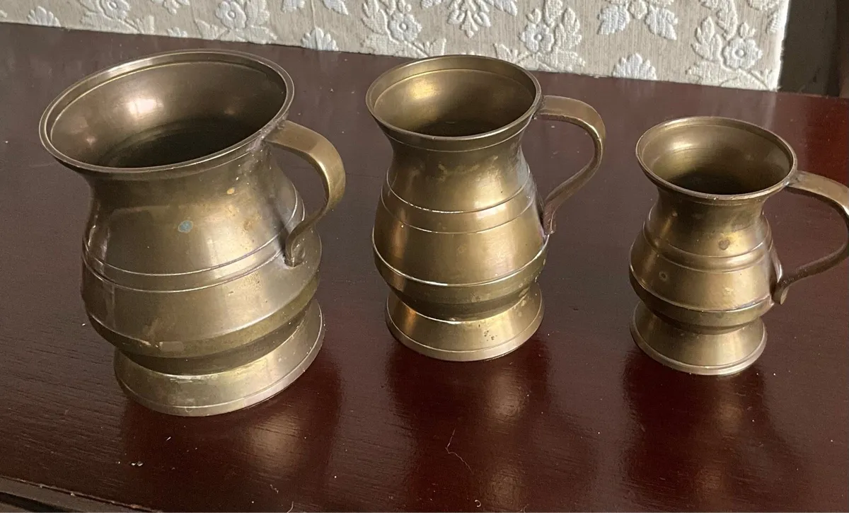 Set of 4 Antique Brass Embossed Pitchers - Image 3