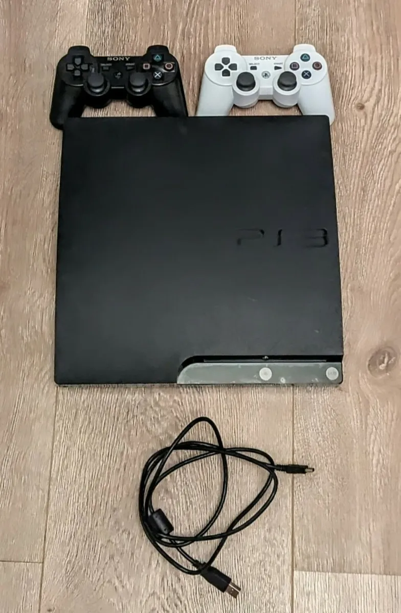 PlayStation 3 + 2x Game Controllers - Image 1