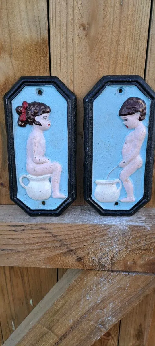 2 cast iron  toilet signs