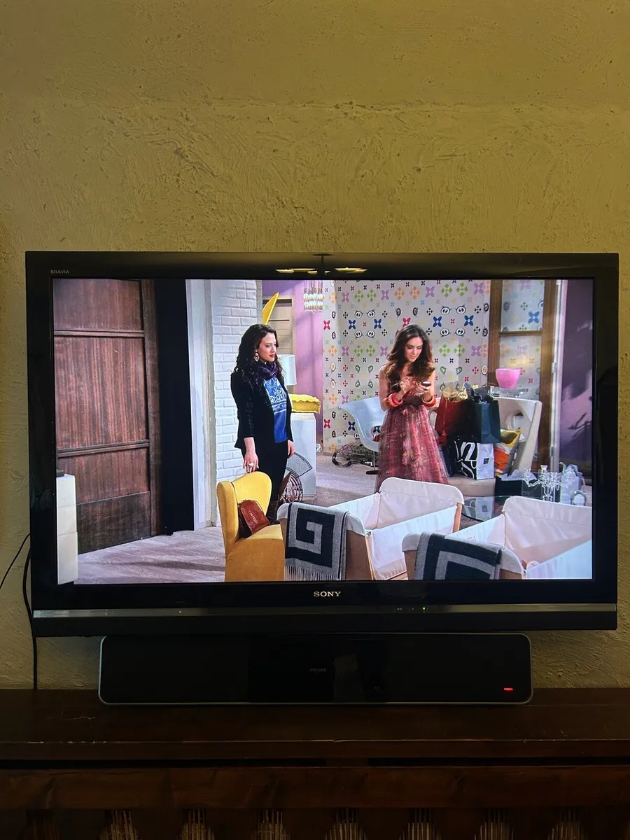55” Sony Tv with Philips sound bar and base - Image 1