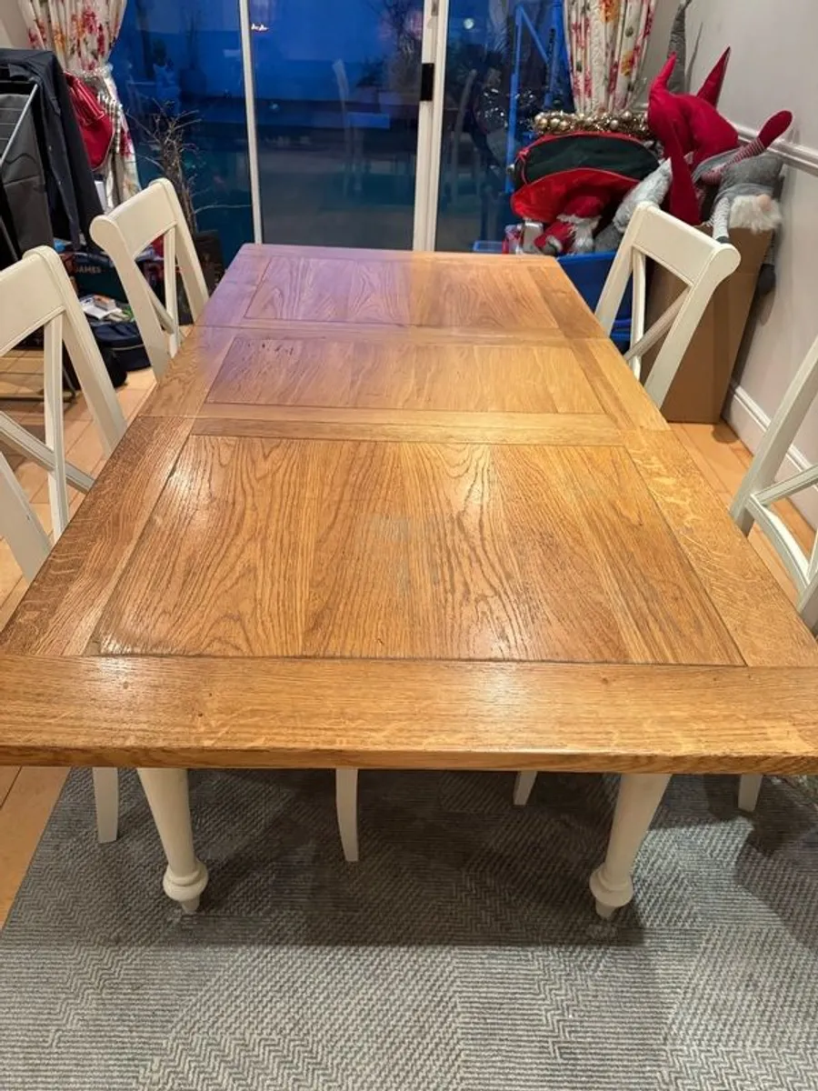 Extendable dining table. With 4 chairs. Good condition priced to sell - Image 1