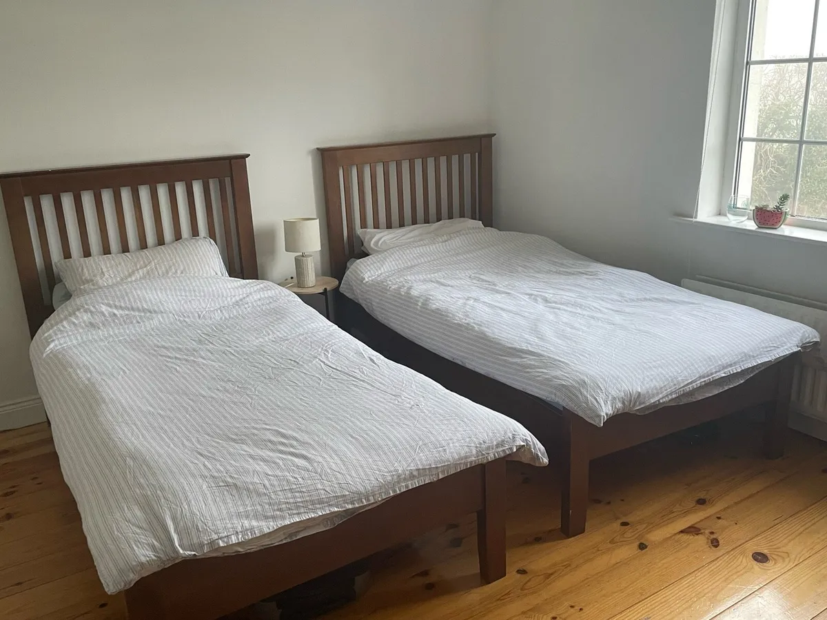 Matching solid wood single beds - Image 1