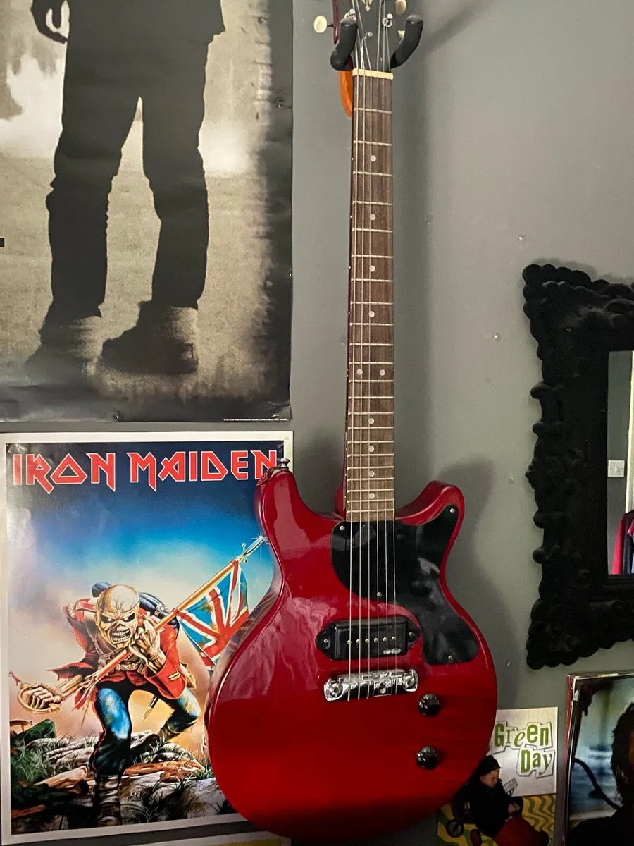 red and black vintage electric guitar - Image 1